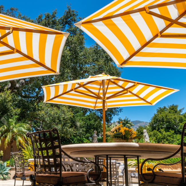 Yellow and white striped umbrellas in Santa Barbara shot by Albiston Creative