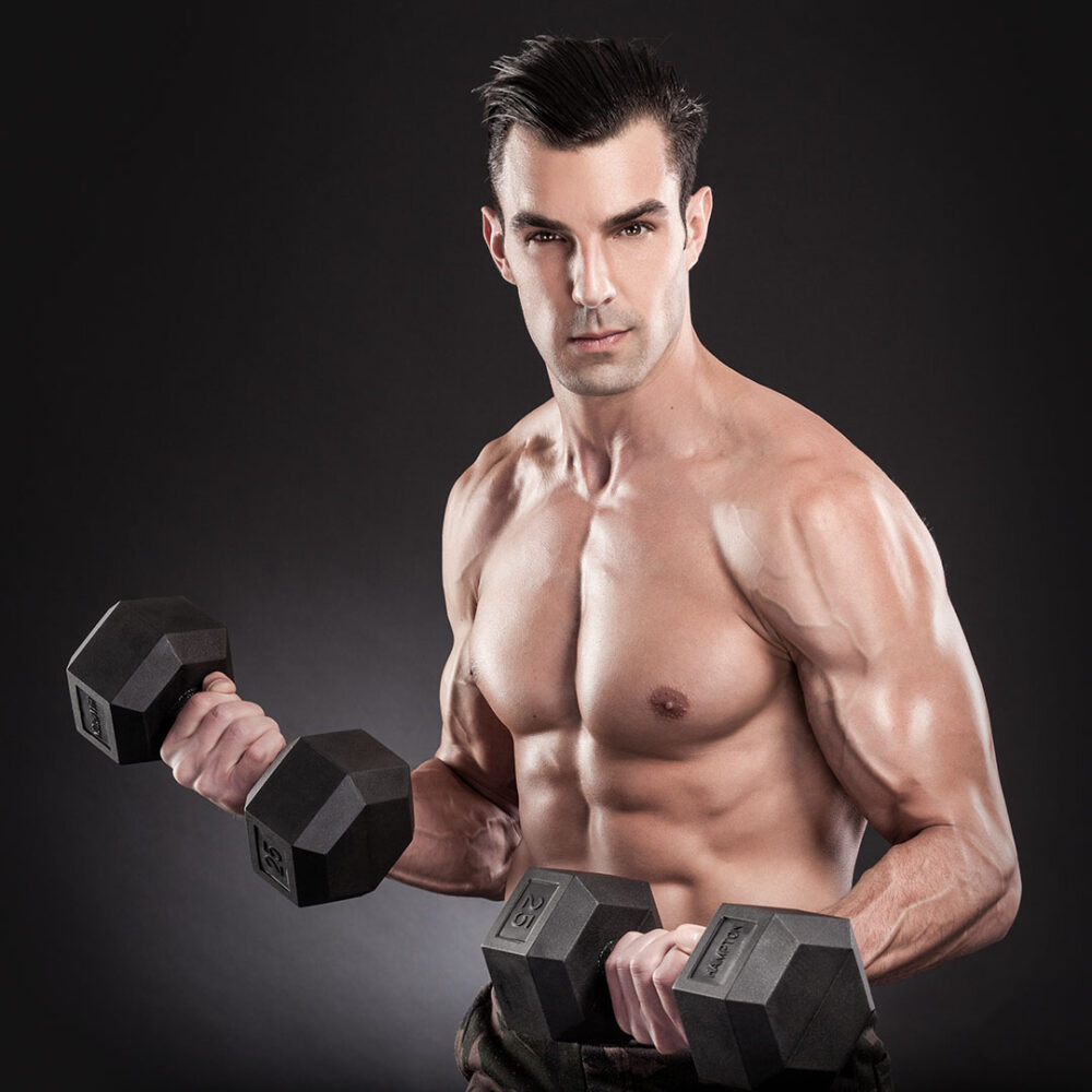 Fitness model holding dumbbells