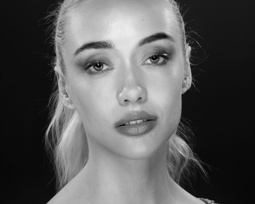 Black and white artistic portrait with black background in Ventura studio